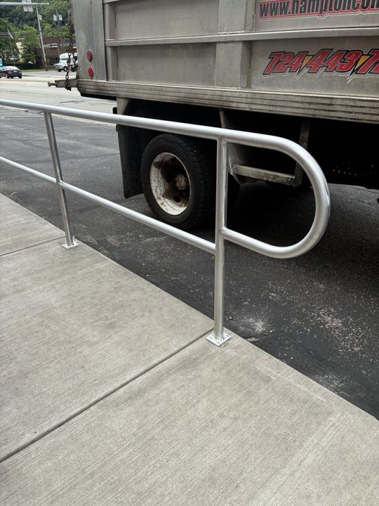 Aluminum ramp railing with a handicap hoop in Etna