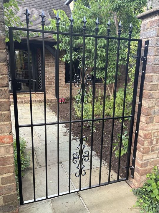 Black aluminum gate with decorative pickets in Fox Chapel