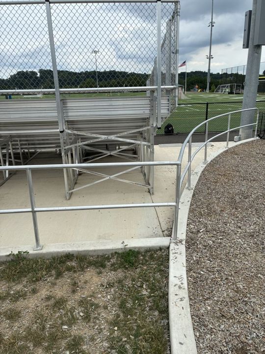 Curved two-bar pipe aluminum railing with rounded end in Richland